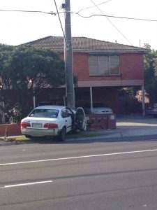A car trapped under a powerpole on Stud Road, Dandenong. Picture: CASEY NEILL