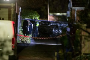Investigators at the scene of a fatal unit fire in Dandenong on 11 August. Picture: GARY SISSONS