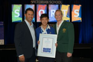 Tang's championship effort, borrowed spikes and all
