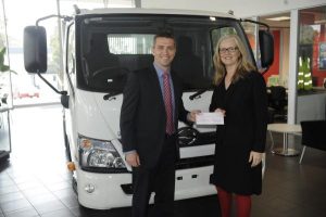 Dealer golf day donation