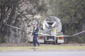 Three safe after truck crashes into home