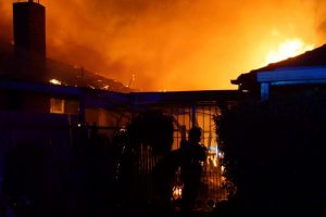 One home distroyed and another saved