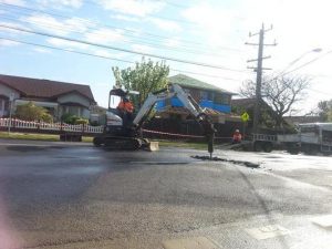 Burst main closes Clow Street
