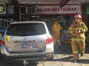 Three injured as car hits restaurant