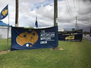 Glass wool workers strike to insulate jobs