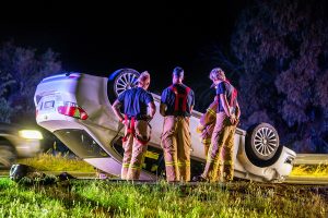 Two injured in car flip