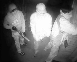 Armed men swarm on home