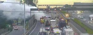 Car fire stalls freeway traffic