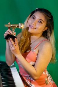 Singer takes on the world from home
