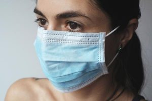 Masks back following fifth new case