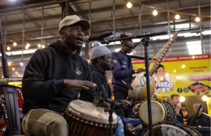 Drummers beat a rhythm