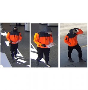 Masked man wanted over supermarket robbery