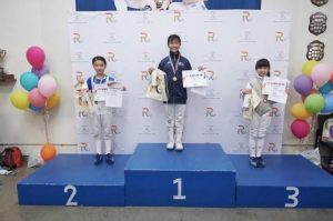 Young fencer parries with the best
