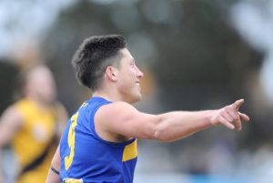 Sketcher salutes with league medal