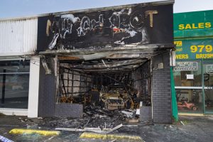 Dandenong shop rammed, torched