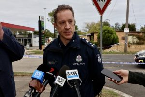 Police shoot allegedly armed woman in car, man charged with carjacking