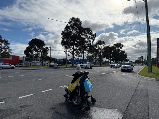 Wheelchair pedestrian braves Dandenong-Frankston Road